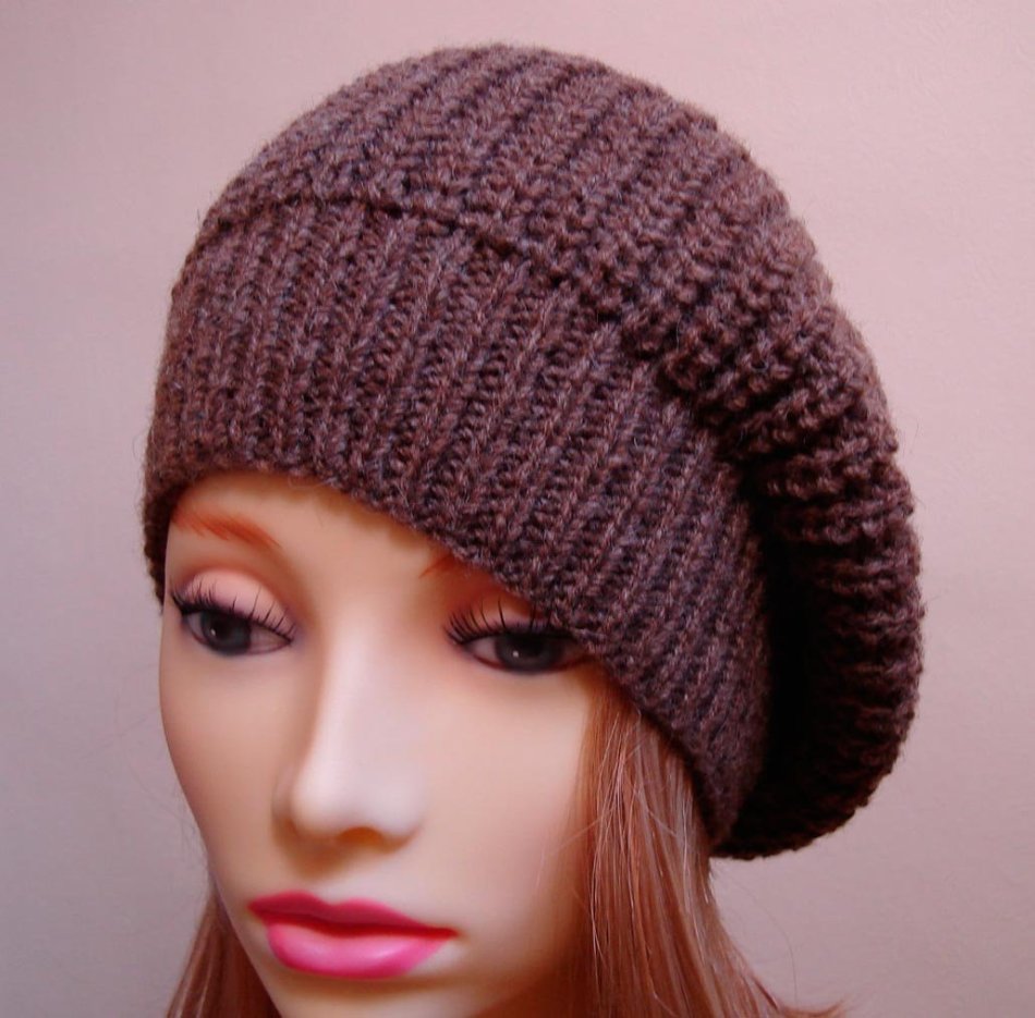 Knitted female berets with an English elastic band on a mannequin