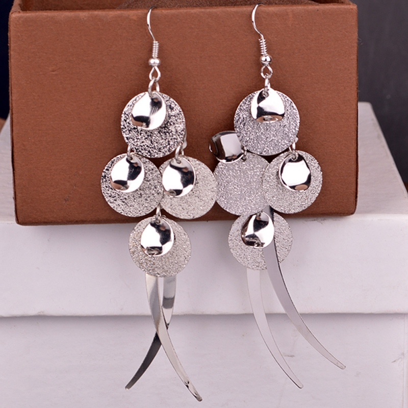 Large silver earrings a la melted shape on 2022-2023