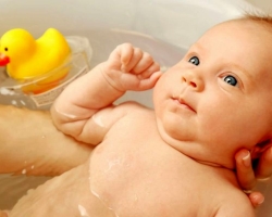 What should be the water temperature for the first bathing of a newborn child and subsequent bathing? What air temperature should be in the bathroom when bathing a newborn and in a children's room after bathing a child?