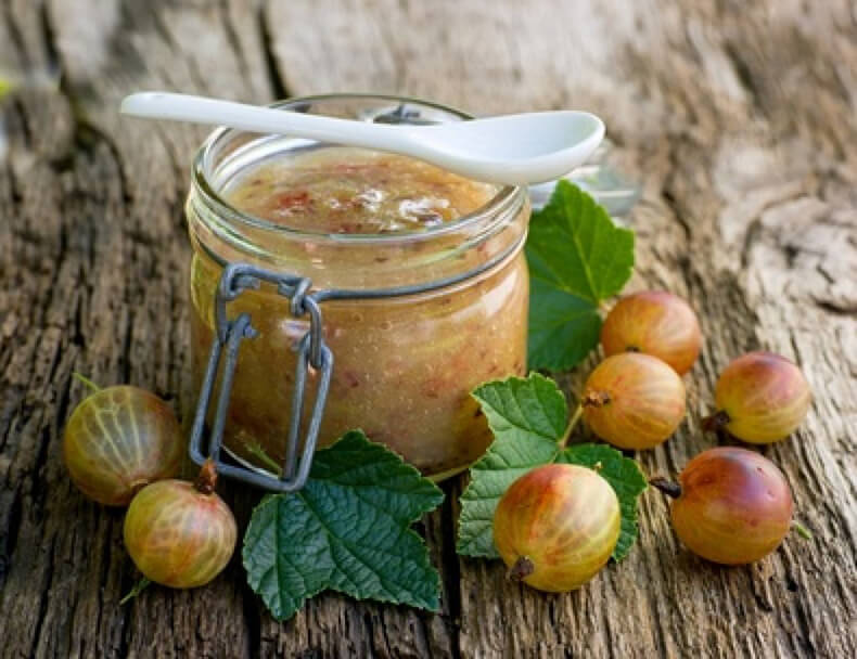 In an open jar of gooseberries with mint