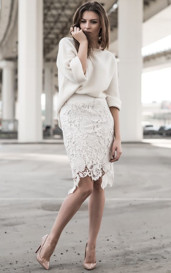 The white lace skirt is miraculously combined even with a white sweater