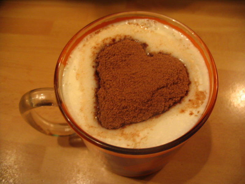Hot chocolate on milk and cocoa powder