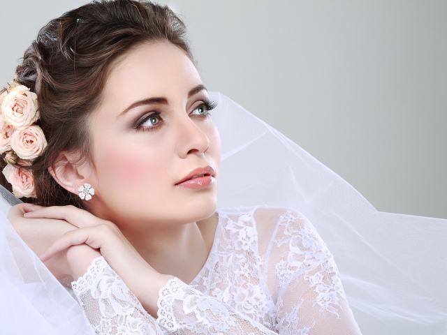 Hairstyles for a wedding for the bride. Wedding hairstyles with a veil and with a diadem. Photo of hairstyles with bangs