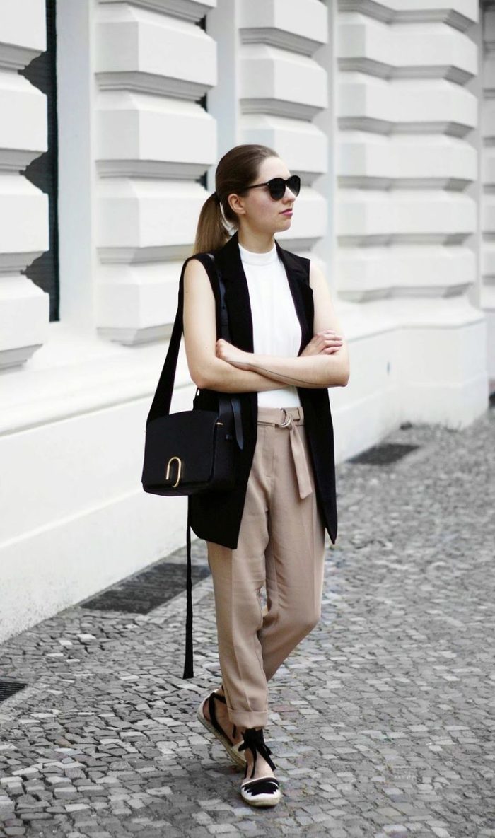 Feminine image with an elongated vest