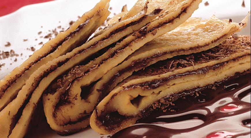 Sweet pancakes with chocolate sauce.