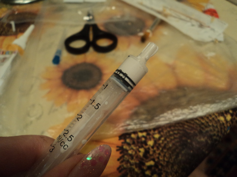 Type texture paste in a syringe for decoupage