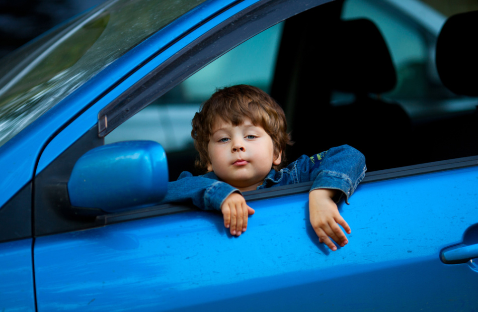 Why is the child sick in a car?