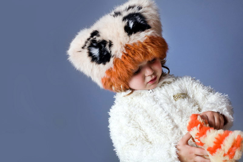 Fashionable children's hats: knitted and fur - cute model
