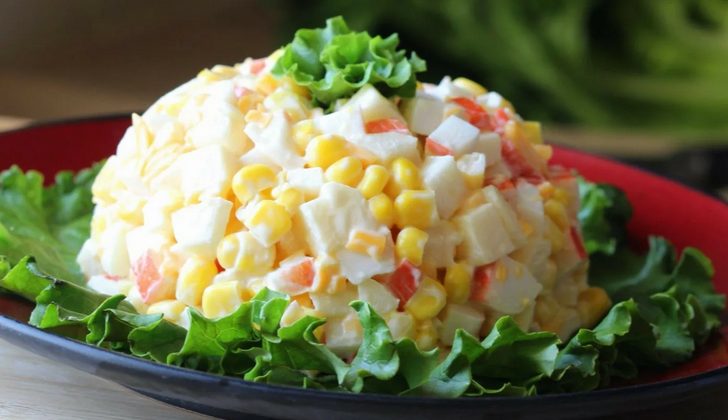 Salad with crab sticks, corn and egg