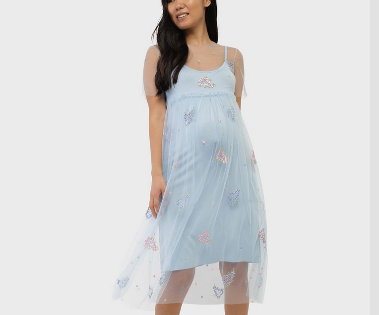 Φόρεμα για μια έγκυο γυναίκα για το νέο έτος 2023