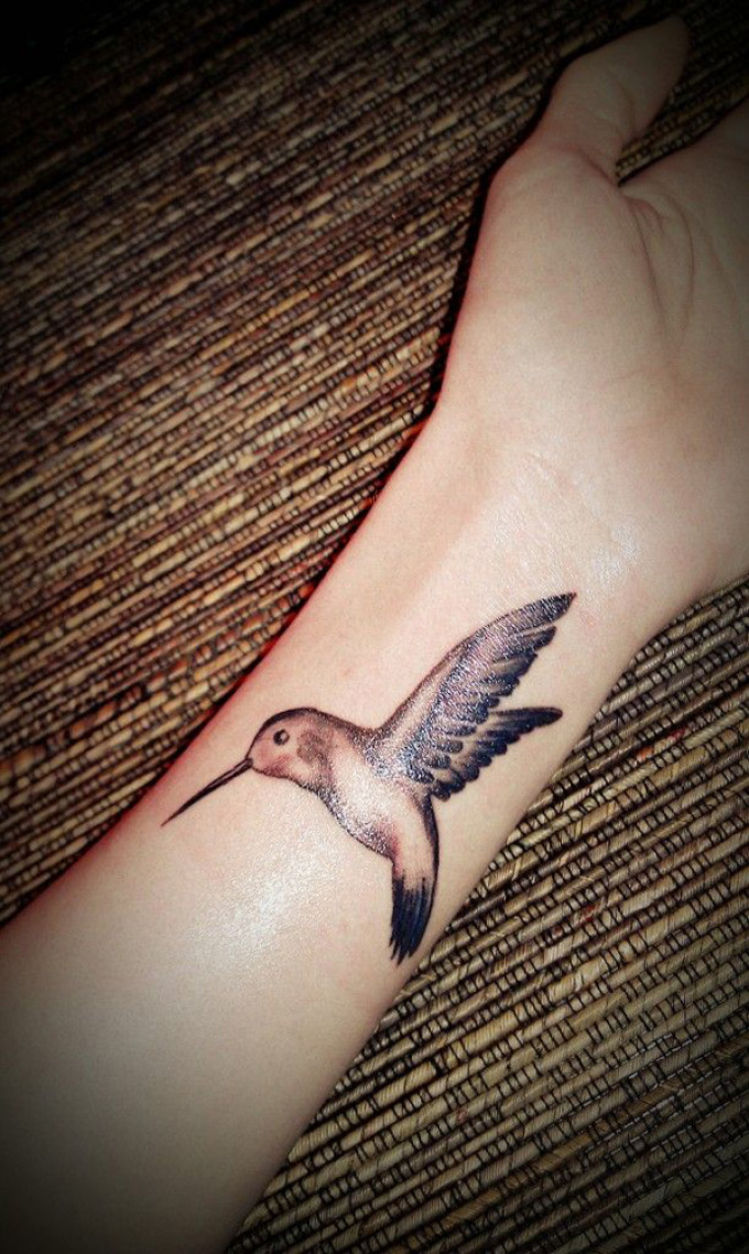 Hummingbird on the arm