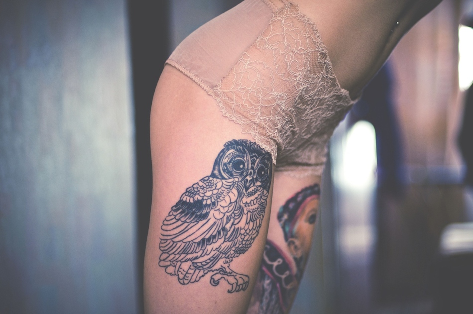 Owl-tata on a female leg